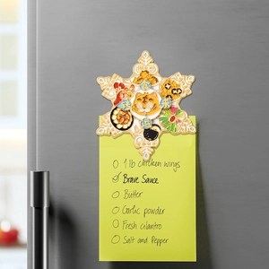Snowflake-shaped metal souvenir fridge magnet featuring cartoon tigers and food patterns