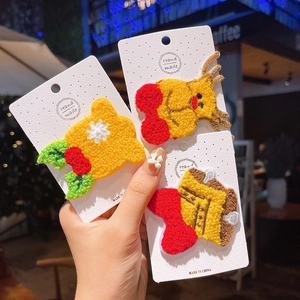 Handmade Christmas plush hair clips with embroidered reindeer and carrot designs for kids