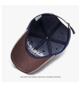 Detail view of cotton baseball cap interior showing 100% cotton label and premium stitching