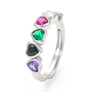 Fashion silver ring with five colorful heart-shaped cubic zirconia stones on white background