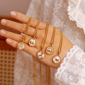 Gold stainless steel zodiac necklaces with round white shell pendants and crystals