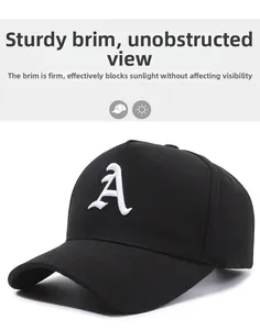Detail of black cotton baseball cap with embroidered A logo and stiff structured brim