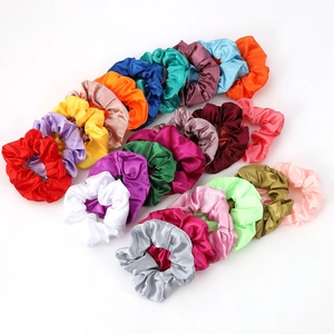 Set of 20 colorful satin silk hair scrunchies in various solid tones on white background