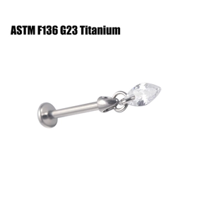 Macro detail of G23 titanium labret stud with marquise-cut sparkling zircon stone