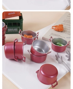 Miniature red dollhouse soup pots with lifelike food props and metal tongs detail