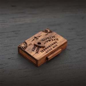 Mini wooden Ouija board with planchette and natural wood grain for home decor