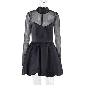 Close-up of elegant black mesh long sleeve dress with satin bubble hem detail
