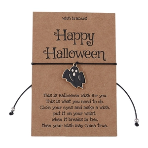 Halloween wish bracelet featuring a black ghost pendant on a brown kraft display card