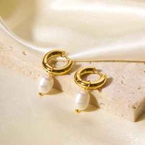 Baroque pearl drop hoop earrings in 18k gold plated stainless steel on silk