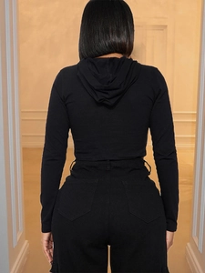 Back view of a black cropped hooded sweatshirt for women with long sleeves