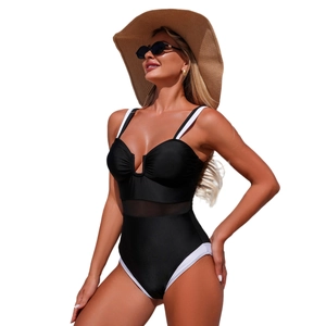 Contrast black and white one-piece swimsuit with mesh paneling and sweetheart V-neckline