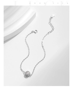 Detailed shot of S925 sterling silver chain bracelet with a single round moissanite stone