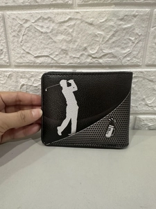 Close-up of black PU leather men's wallet featuring white golfer silhouette graphics