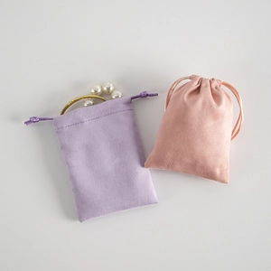 Pink and lilac velvet jewelry drawstring pouches for soft storage and gift packaging