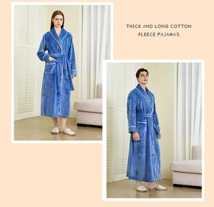 Detailed view of thick navy blue flannel robes with white piping and belted waist for adults