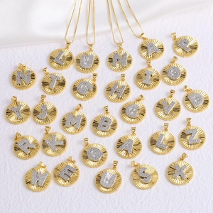 Gold and silver capital letter necklaces with sparkling rhinestones in a sunburst design