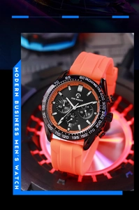 Detail of multi-functional quartz watch with orange silicone strap on a neon display