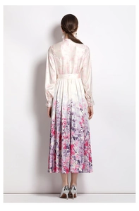 Full back view of a satin floral dress with lantern sleeves and a belted waist design