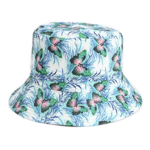 Close-up of the butterfly and botanical print detail on the white sun hat fabric