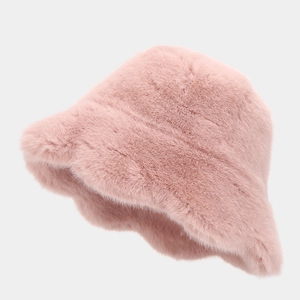 Detailed close-up of pink faux rabbit fur bucket hat texture and wavy brim structure