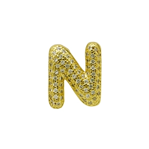 Detailed close-up of a gold-plated letter N charm pavé-set with sparkling cubic zirconia