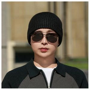 Close-up of black ribbed knit beanie with thick thermal lining for winter outdoor use