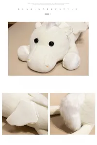Detailed close-up of soft white plush horse toy featuring wings and embroidered facial details