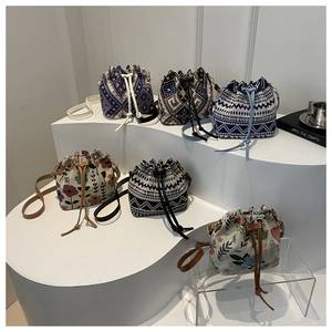 Set of ethnic style drawstring bucket bags with floral embroidery and geometric patterns