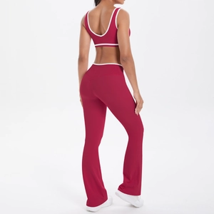 Detail of burgundy yoga set featuring white contrast binding and a high waist flare fit