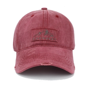 Vintage washed burgundy baseball cap with embroidered mountain patch and distressed details