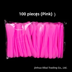 Bulk pack of 100 transparent pink plastic facial mask spatulas in clear packaging