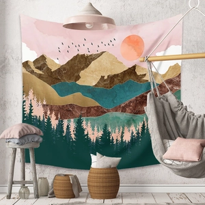 Detail of bohemian nature tapestry with mountain landscape and cozy home decor elements