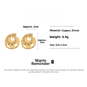 Detailed view of irregular gold zircon earrings with 2cm dimensions and silver pins