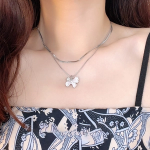 Silver layered butterfly choker with crystal pendant and snake chain on model