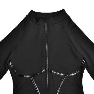 Detail of black long sleeve bodysuit featuring high collar zipper and glossy leather stitching