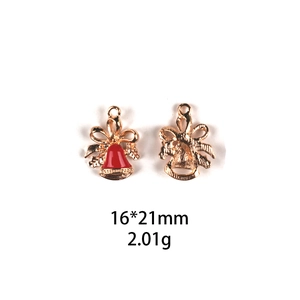 Detail of Christmas bell pendant with 16x21mm dimensions and golden metal finish