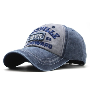 Detail of vintage washed cotton baseball cap featuring 3D embroidery and distressed edges