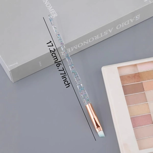 Angled eyebrow makeup brush with crystal glitter handle and rose gold ferrule, 17.2cm length