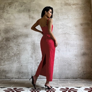 Detailed back view of red jacquard halter dress showing open back and tie-up waist detail