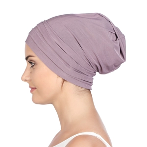 Close-up of pleated purple chemo headwrap cap showing elastic modal fabric detail