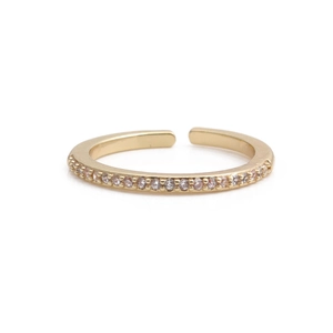 Close-up of adjustable gold ring featuring a row of pave-set white cubic zirconia stones