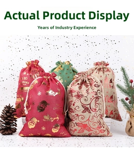 Detailed view of burlap Christmas drawstring gift bags with gold foil holiday patterns