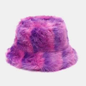 Close-up of plush fuzzy bucket hat featuring a pink and purple plaid checkered pattern
