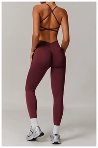 Rear view of wine red yoga set featuring high waist scrunch leggings and strappy sports bra