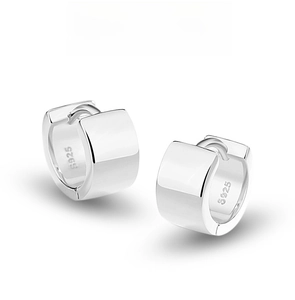 Macro shot of S925 sterling silver stamp on minimalist square mirror-finish huggie earrings