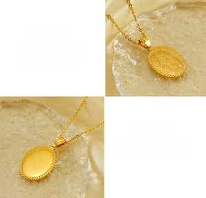 Macro detail of gold titanium steel religious pendant with Virgin Mary relief engraving