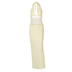 Detail of yellow backless halter dress featuring sheer mesh patchwork and waist ruching