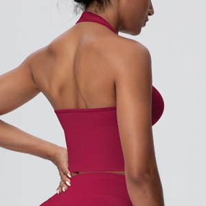 Detail of burgundy ribbed seamless sports crop top showing racerback and halter neck