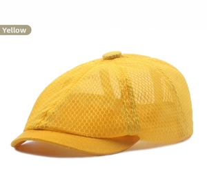 Close-up of bright yellow kids newsboy cap showing breathable honeycomb mesh fabric