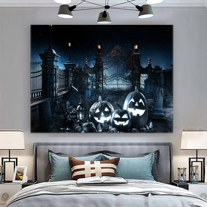 Detail view of Halloween tapestry showing glowing pumpkins and spooky cemetery in a bedroom